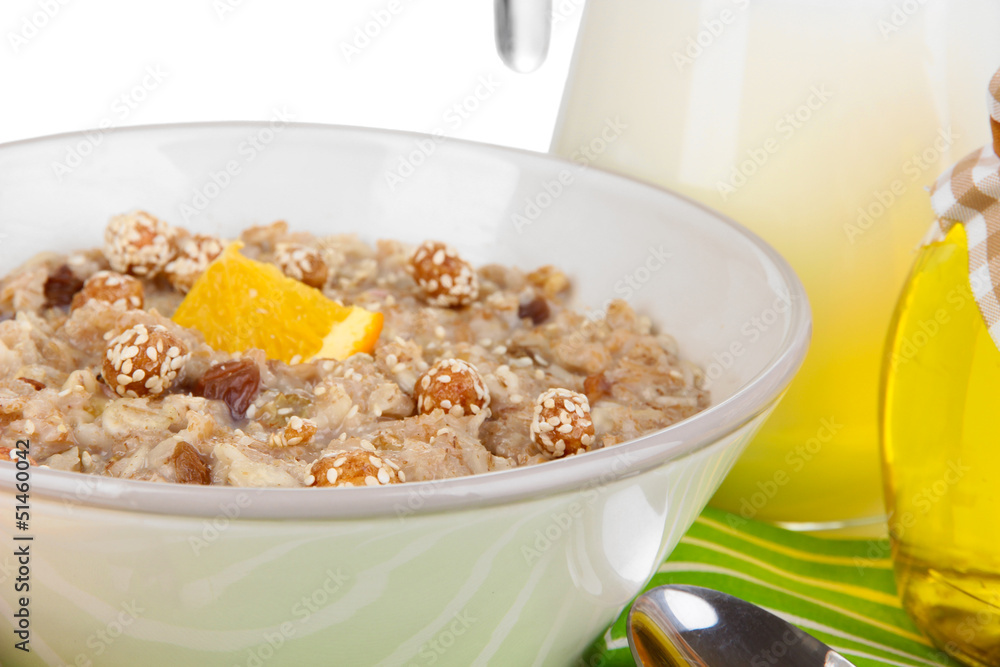 Useful oatmeal in bowl with fruit isolated on white Useful oatmeal in bowl with fruit isolated on white