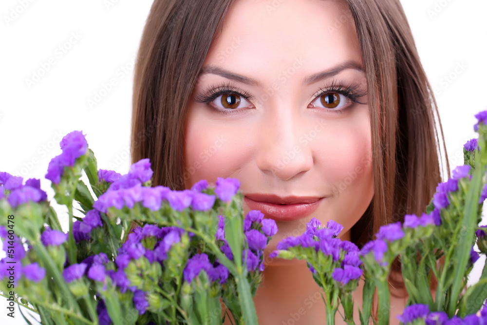 Beautiful young woman with flowers isolated on white Beautiful young woman with flowers isolated on white