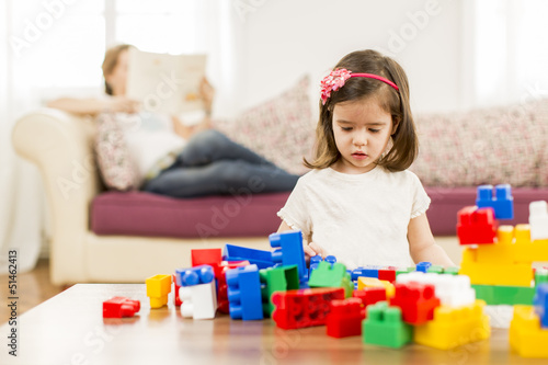 Little girl playing in the room