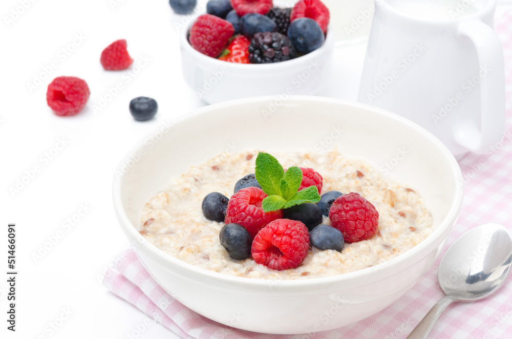 healthy breakfast - oatmeal with fresh berries isolated on white healthy breakfast - oatmeal with fresh berries isolated on white