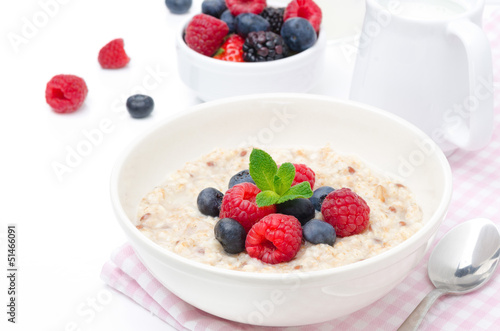 healthy breakfast - oatmeal with fresh berries isolated on white