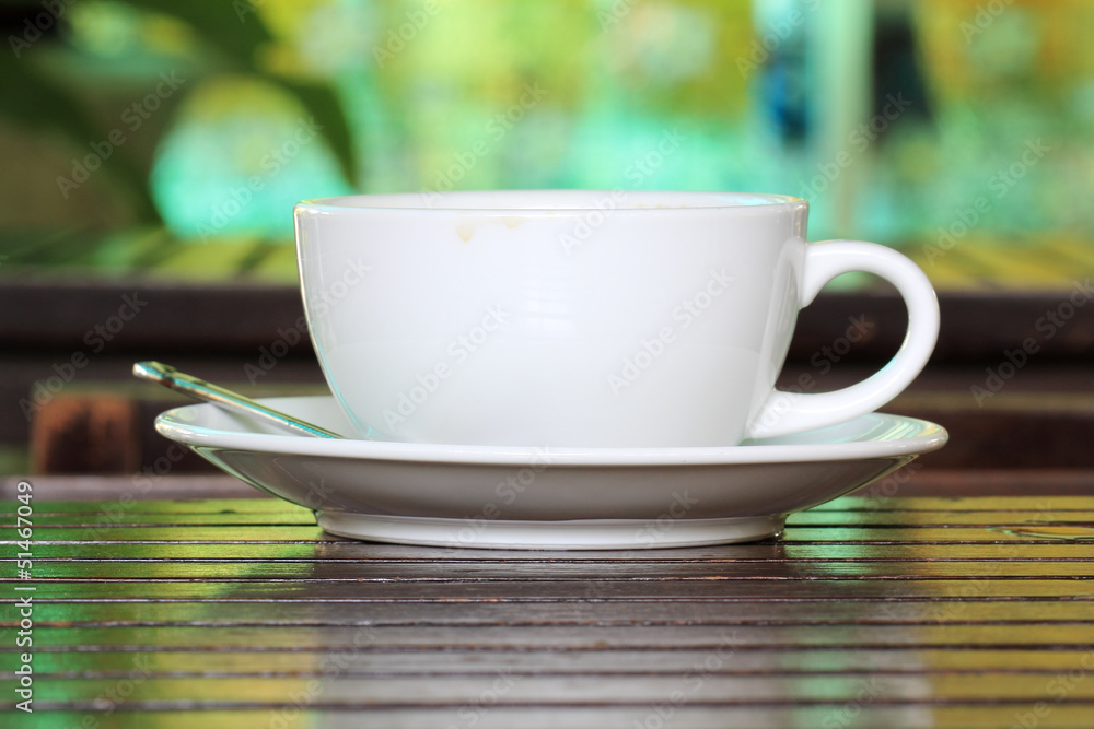 cup of coffee on wooden table cup of coffee on wooden table