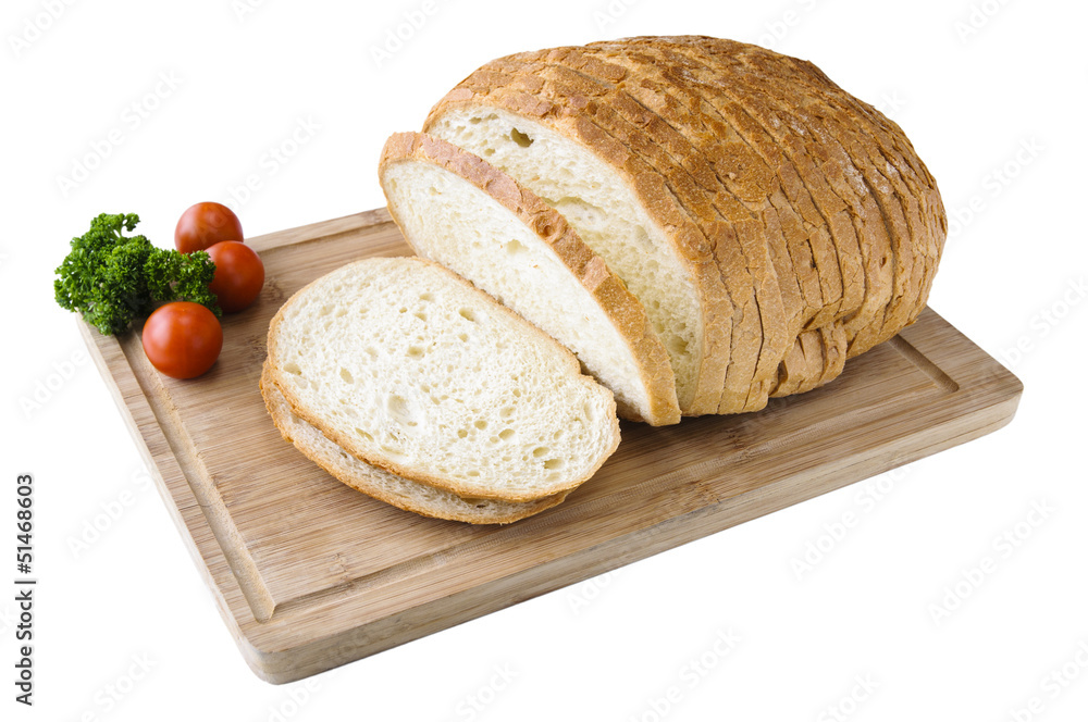 Cutted white bread on the wooden board with tomatos Cutted white bread on the wooden board with tomatos