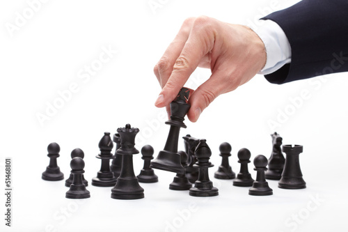 Business man moving chess figure