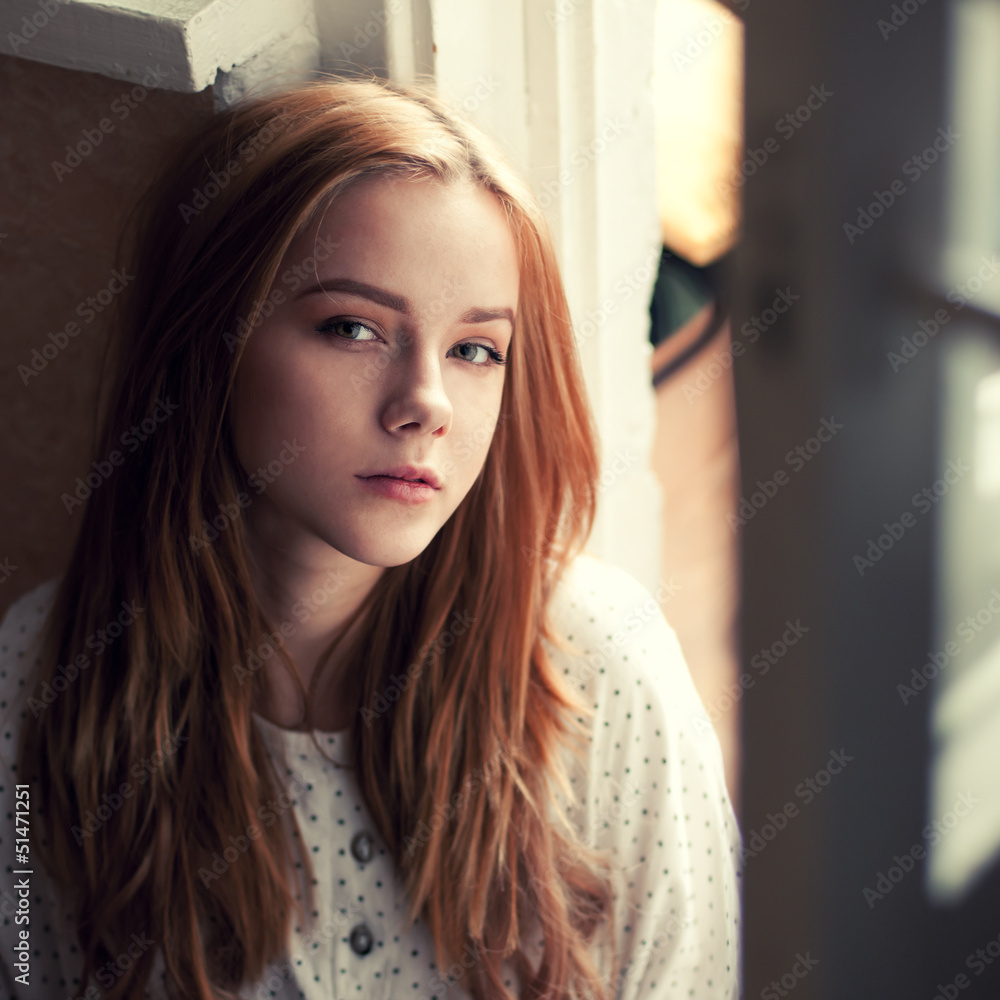 Fototapeta premium portrait of a beautiful blonde at home