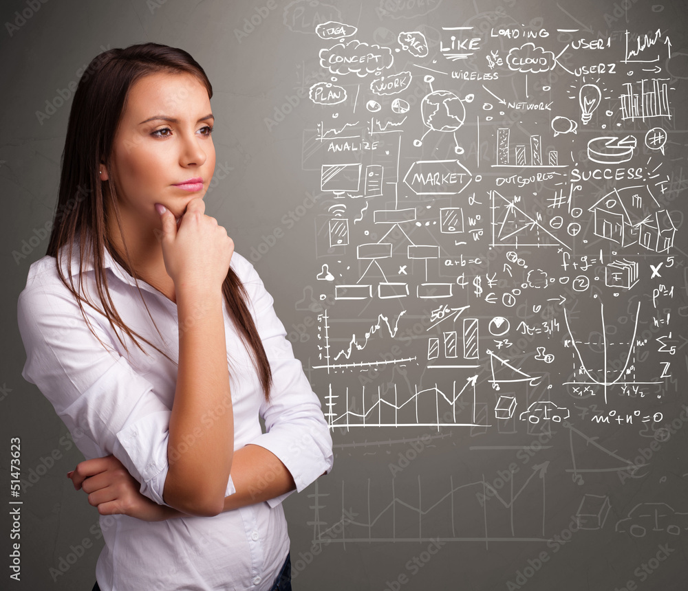 Fototapeta premium Pretty woman looking at stock market graphs and symbols