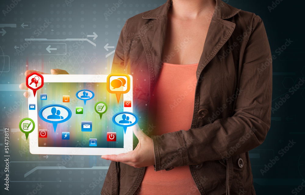 Girl presenting a tablet with colorful social icons and signs Girl presenting a tablet with colorful social icons and signs