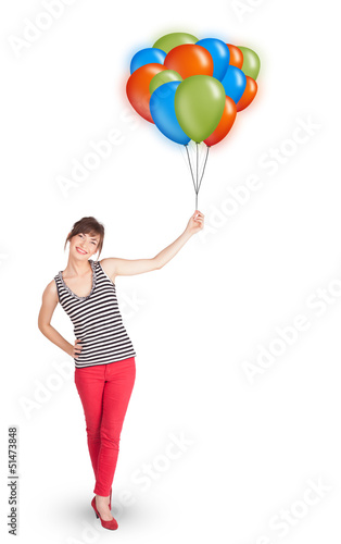 Young woman holding colorful balloons © ra2 studio