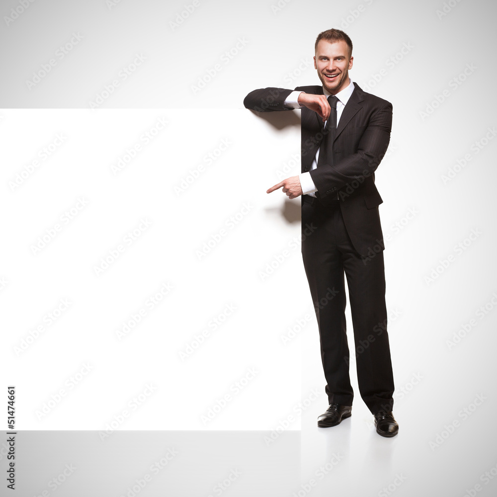 Portrait of business man showing blank signboard Portrait of business man showing blank signboard