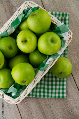 Green apples in white basket