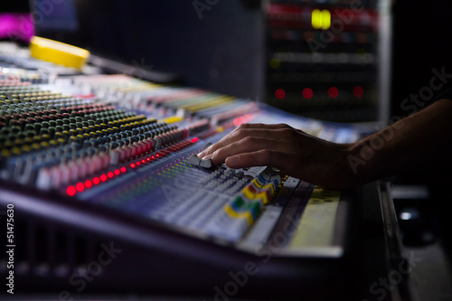Soundman working on the mixing console.