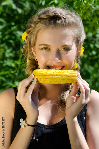 woman eating corn-cob