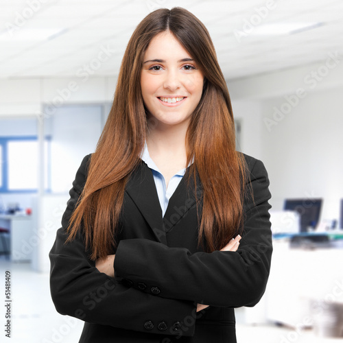 Smiling businesswoman in her office