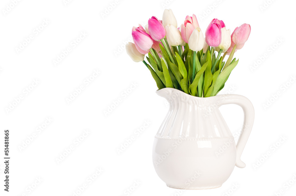 Obraz premium white tulips in a vase on a white background.