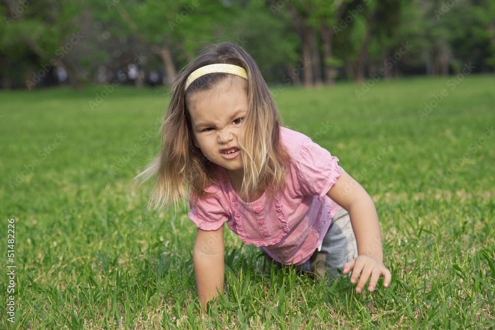 A girl shows a wild animal in the park A girl shows a wild animal in the park