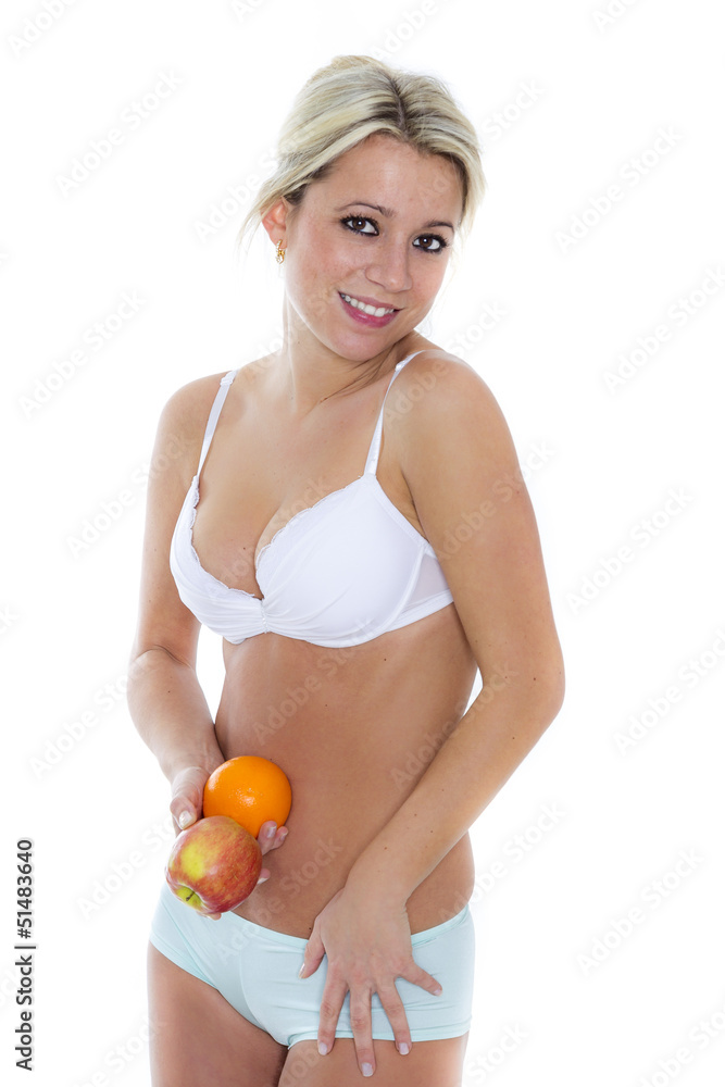 Blondine in Unterwäsche hält Früchte vor Bauch Stock Photo | Adobe Stock