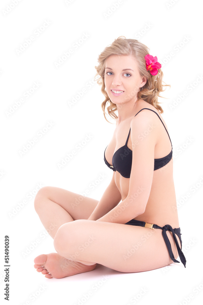 young beautiful woman in bikini sitting on white background