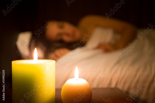 Woman relaxing in bed  dish focus 