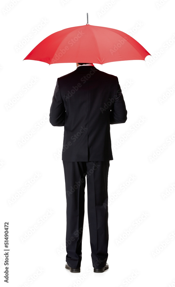 Back view of man in suit with opened red umbrella Back view of man in suit with opened red umbrella