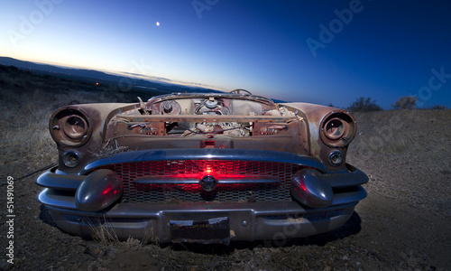 Abandoned vehicle in the desert.