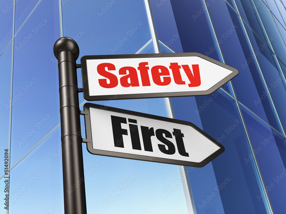 Protection concept: Safety First on Business Building background