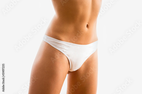 Slim tanned woman's body © chagin