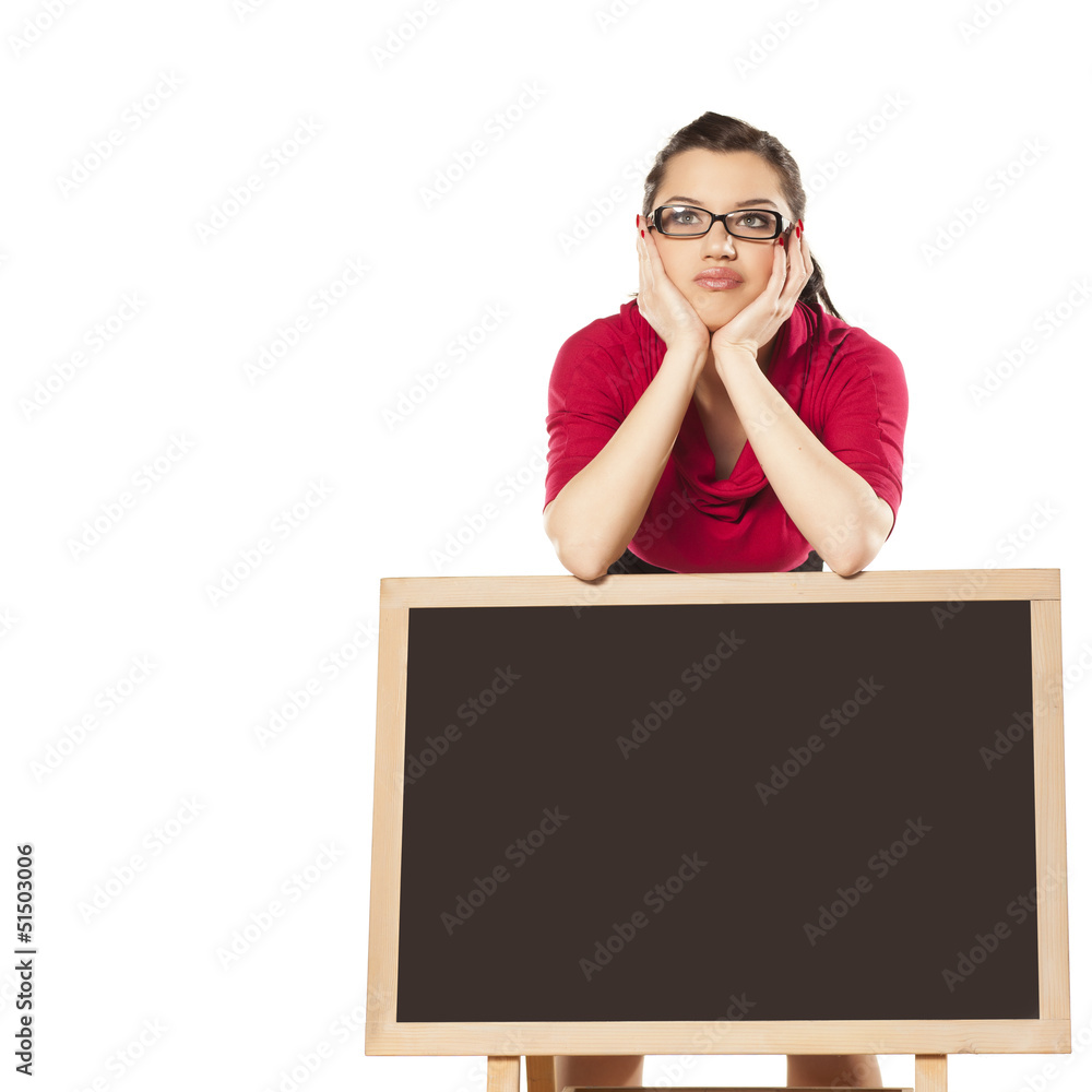 girl with glasses, standing behind an empty table girl with glasses, standing behind an empty table