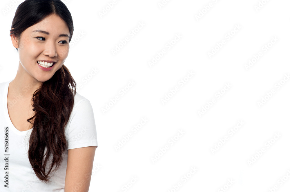Beautiful smiling asian model looking away Beautiful smiling asian model looking away