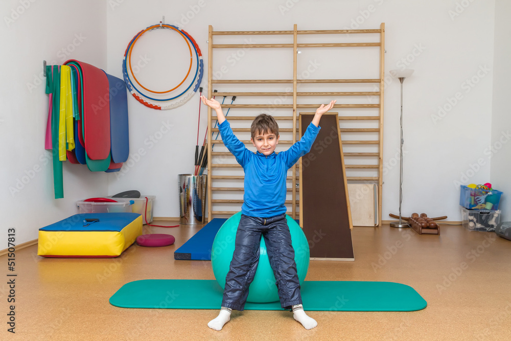 Child is therapeutic exercises in the gym Child is therapeutic exercises in the gym