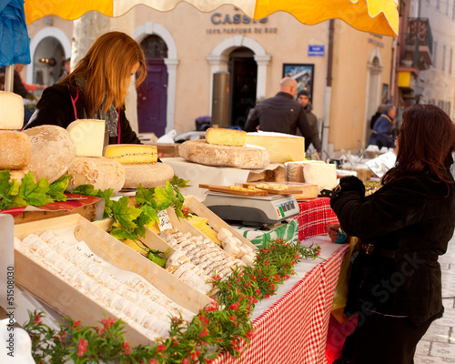 Fototapeta Naklejka Na Ścianę i Meble -  Sale of French cheese in a street market in Cassis