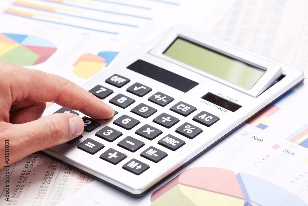 Accountant working with calculator. Accountant working with calculator.