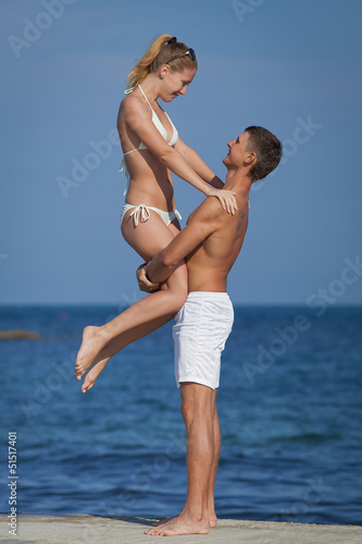 Attractive couple at the sea © azazello