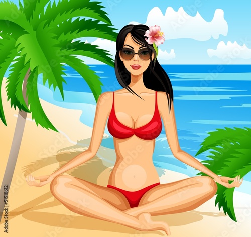 Tanned girl meditating on the beach