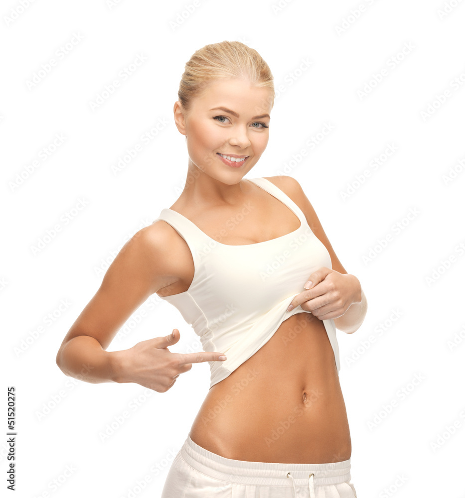 Fototapeta premium beautiful sporty woman pointing at her abs