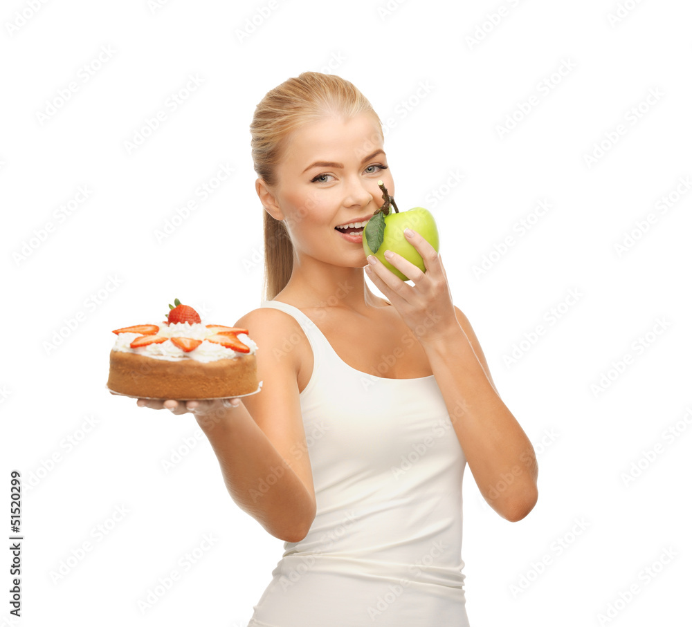 woman eating apple and holding cake woman eating apple and holding cake