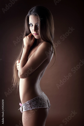 Portrait of sexy topless woman with long hair