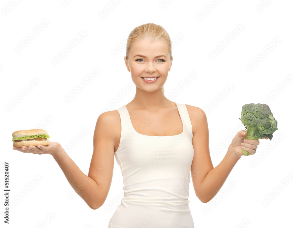 woman with broccoli and hamburger woman with broccoli and hamburger