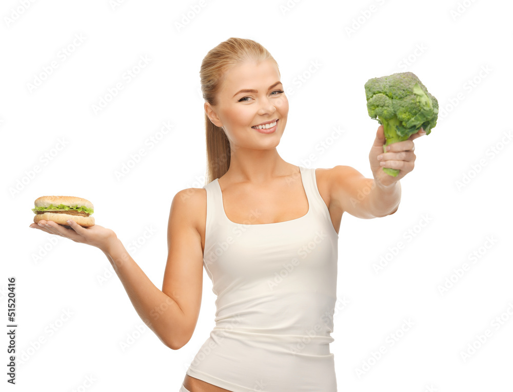 woman with broccoli and hamburger woman with broccoli and hamburger