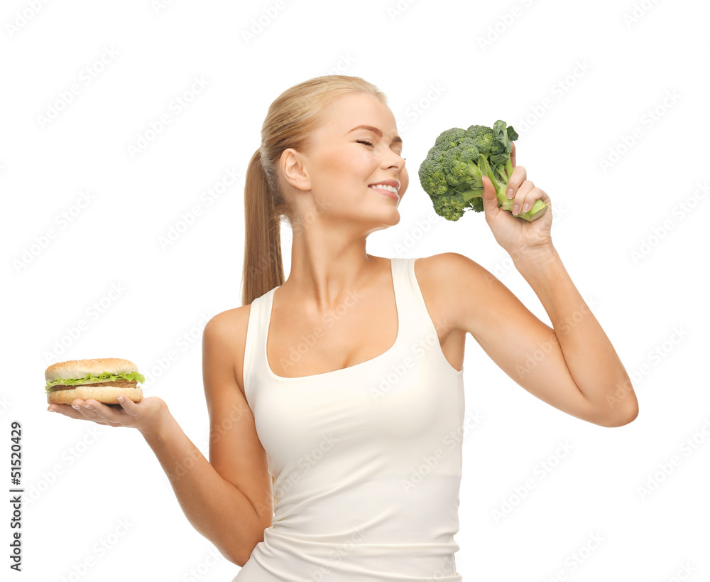 woman with broccoli and hamburger woman with broccoli and hamburger
