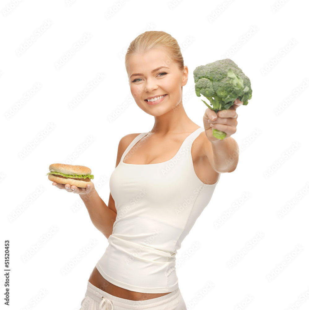 woman with broccoli and hamburger woman with broccoli and hamburger