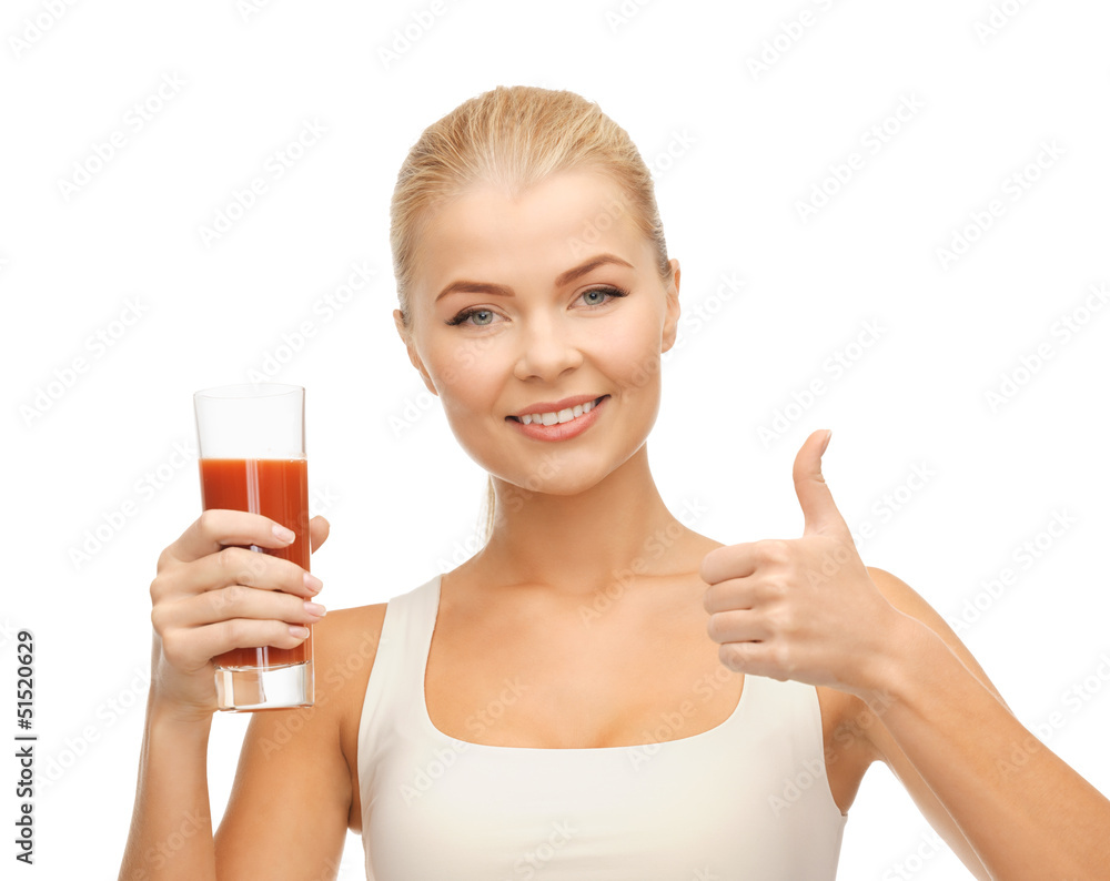 woman holding glass of tomato juice woman holding glass of tomato juice