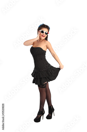Beautiful pin-up style model posing over white background