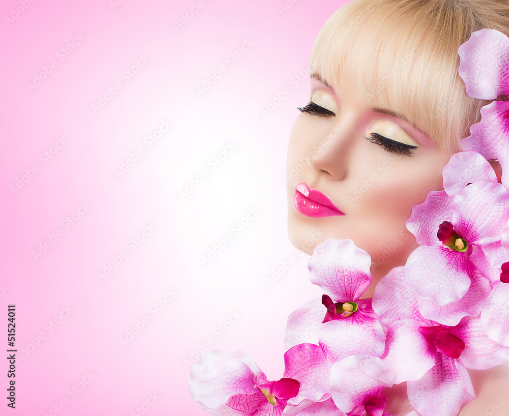 Pretty girl with flowers and perfect makeup