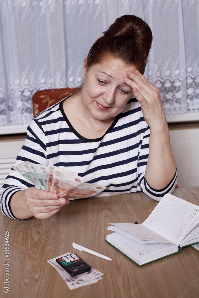 Elderly woman holding money in hand Elderly woman holding money in hand