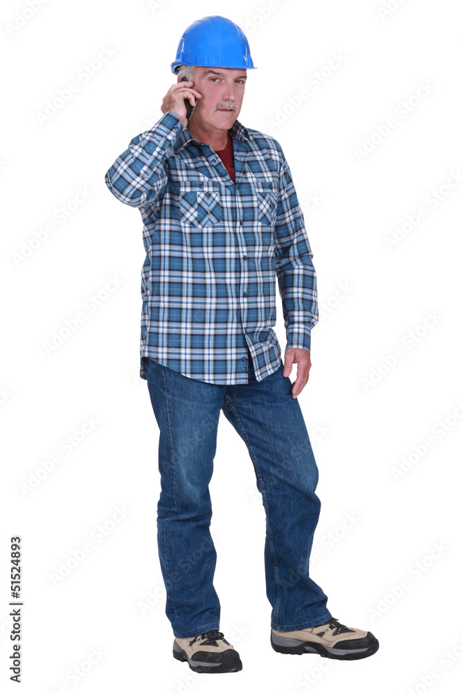 Laborer with mobile phone Laborer with mobile phone