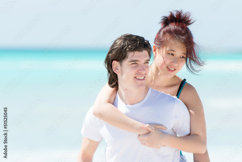 Portrait of a happy young couple having fun on the beach Portrait of a happy young couple having fun on the beach