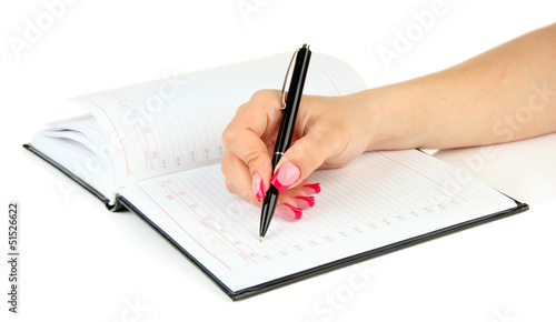 Hand signing in notebook, isolated on white