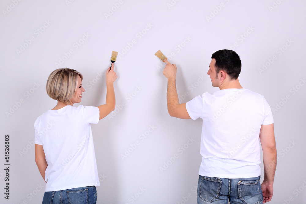 Young couple doing renovation together.