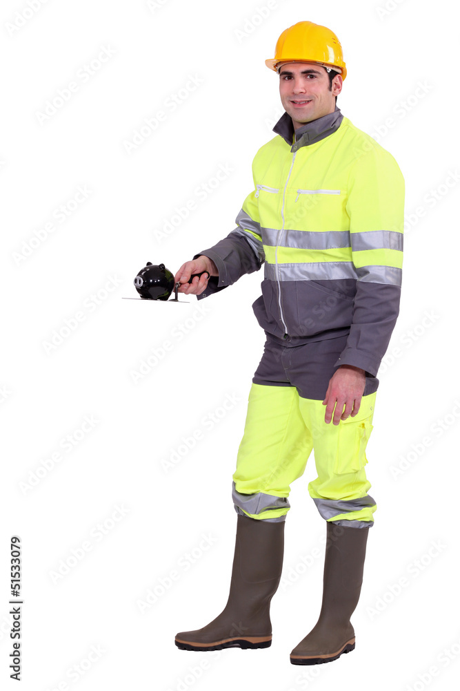 Worker with a piggy bank Worker with a piggy bank