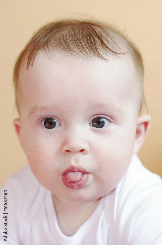 baby age of 7 month put out tongue